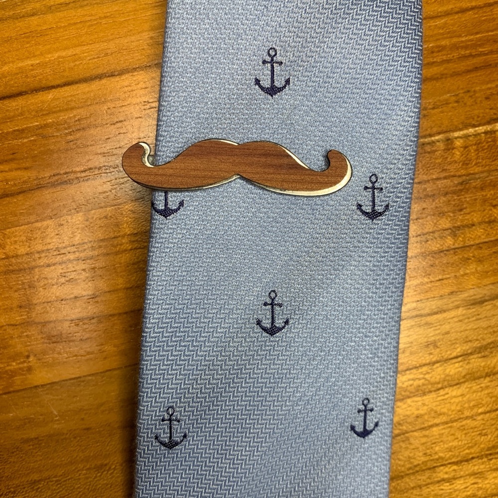 Wood-plated brown mustache tie bar